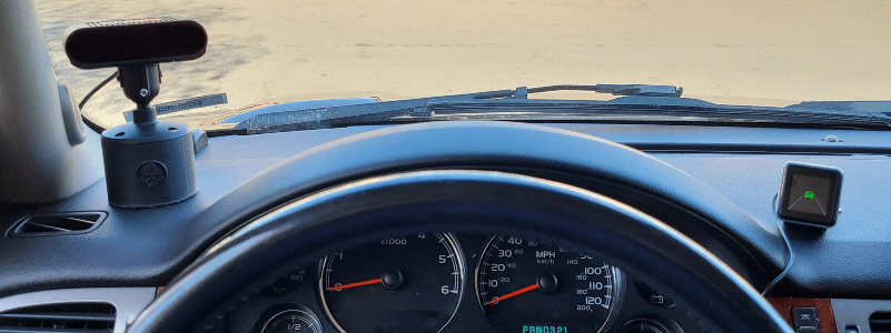 an ai camera and in cab alert set up on a dashboard of a vehicle